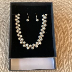 Silver and gray pearl earring and necklace set.